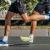 legs two male runners running city marathon race, athletes jogging on asphalt road, summer sports games